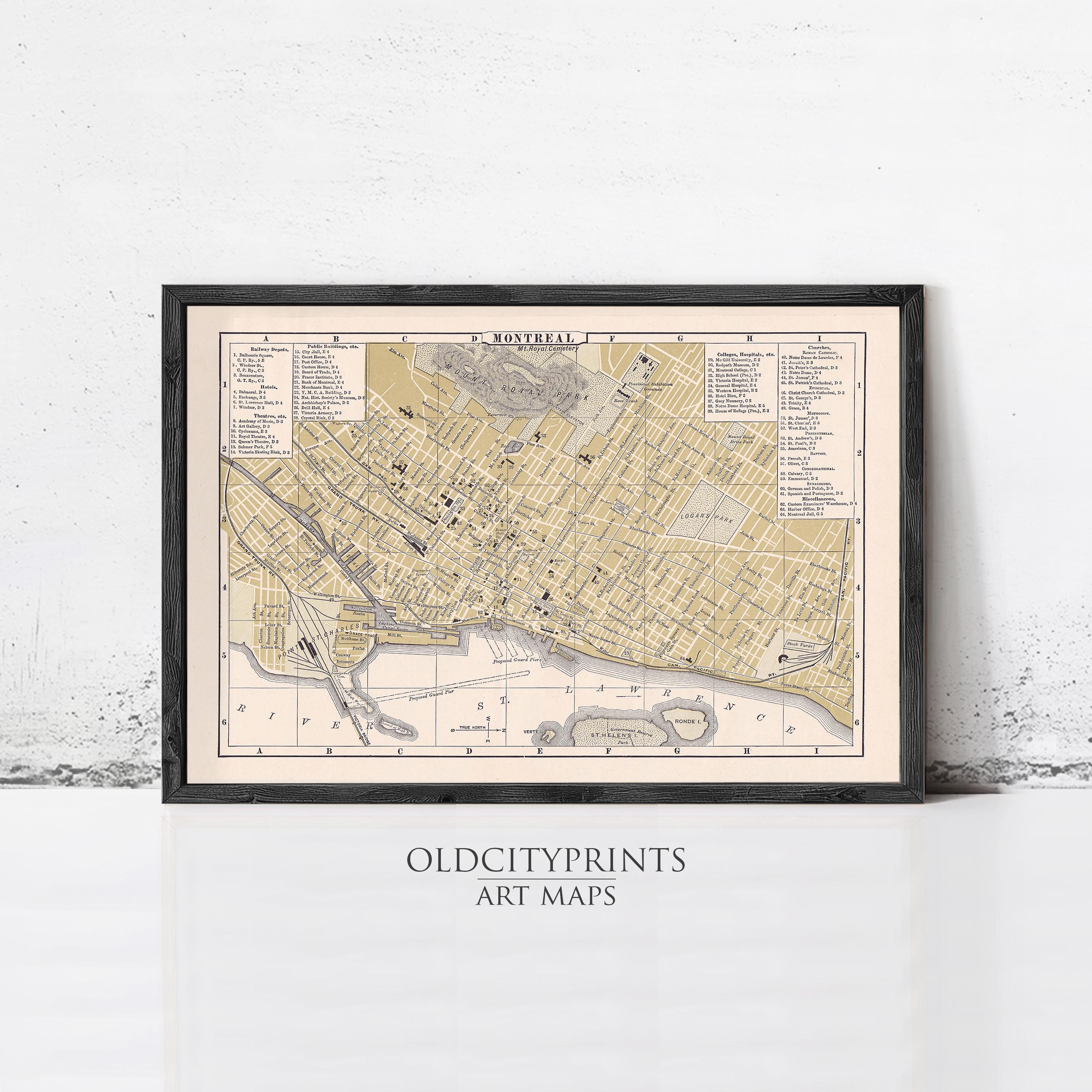The image is a framed vintage map of a city, likely from the past, with detailed street names and landmarks.