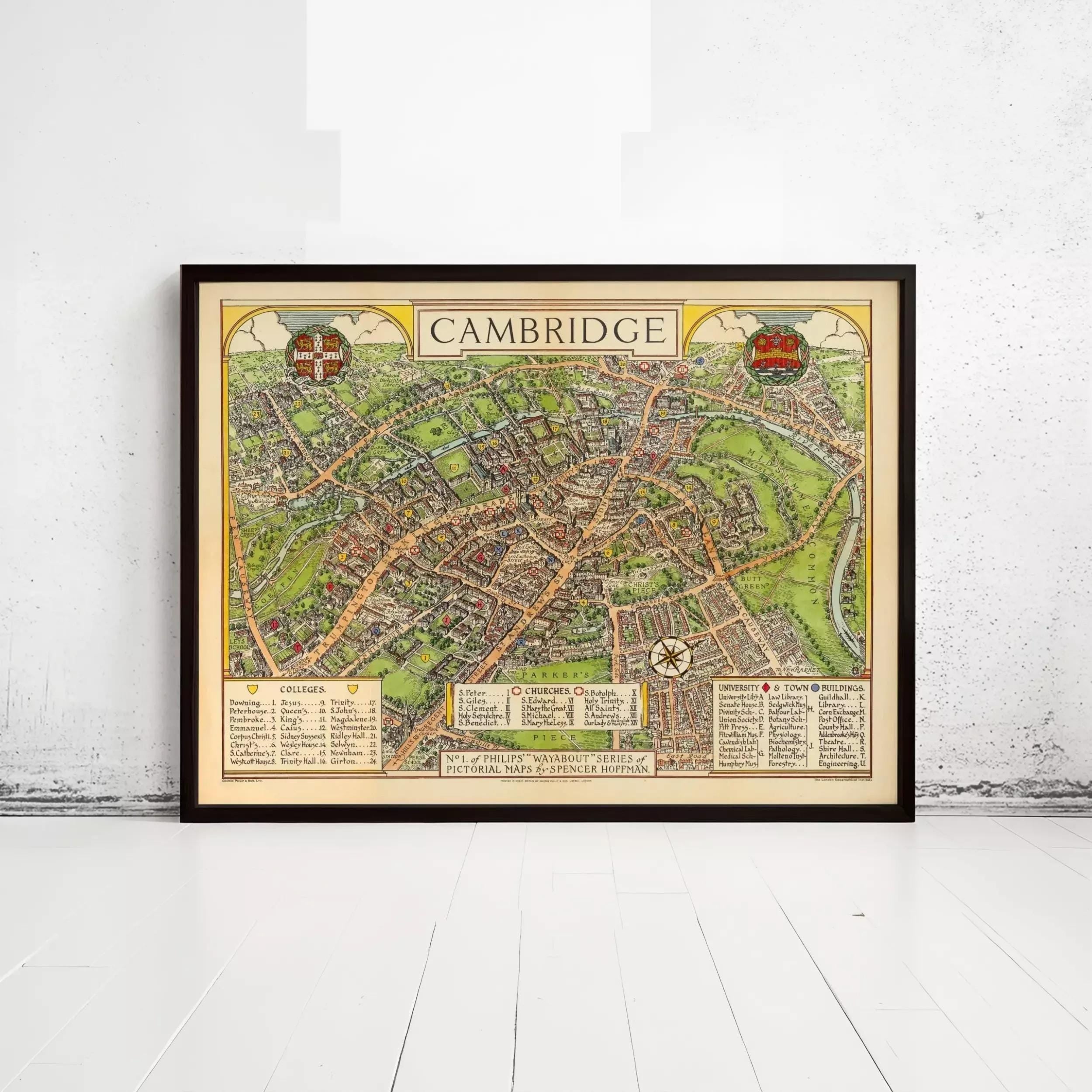 The image is a framed vintage map of Cambridge, England, depicting the city's layout and surrounding areas.